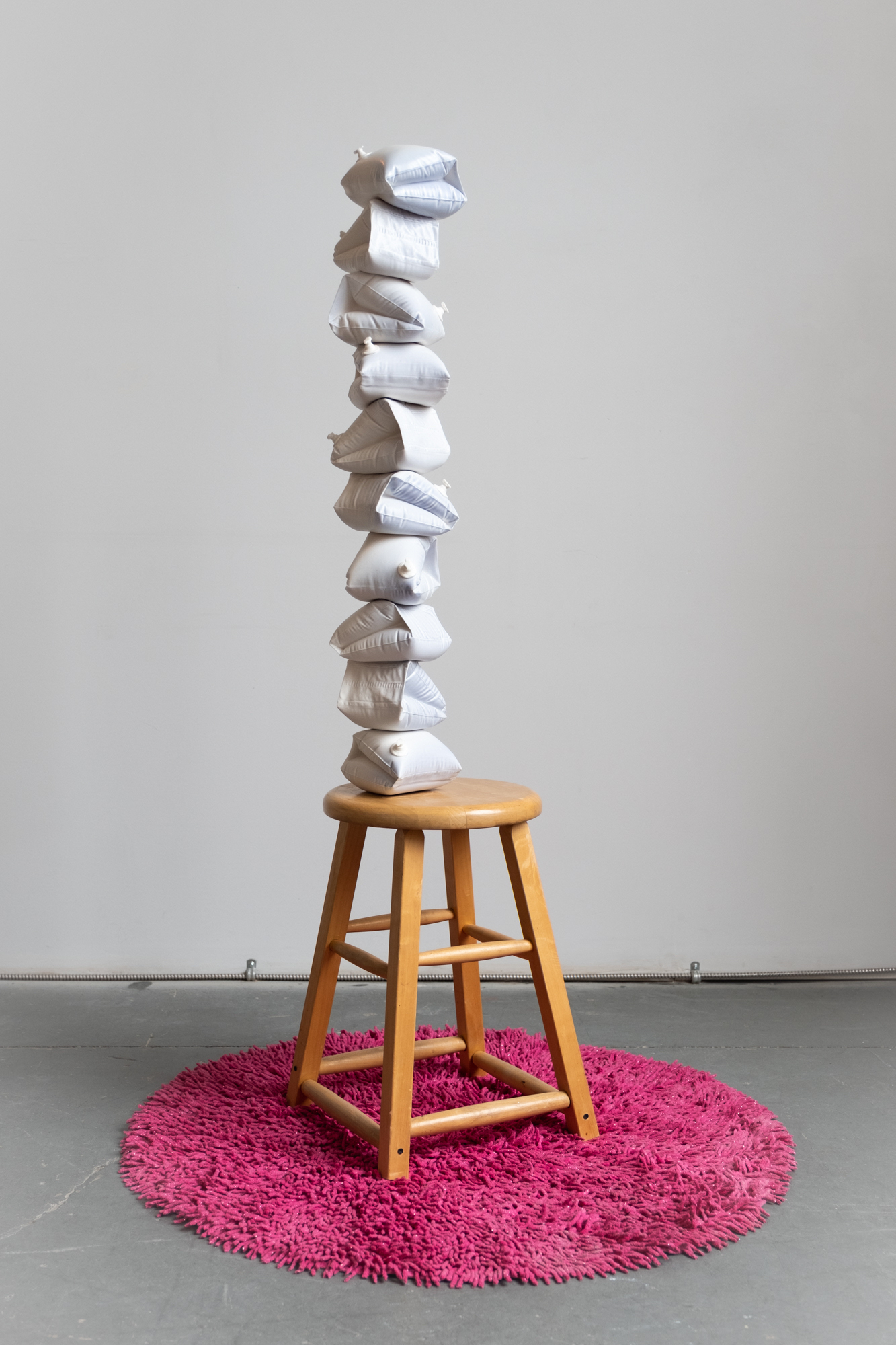 Media includes cast porcelain, glaze, lustre, walnut, steel, shag rug.