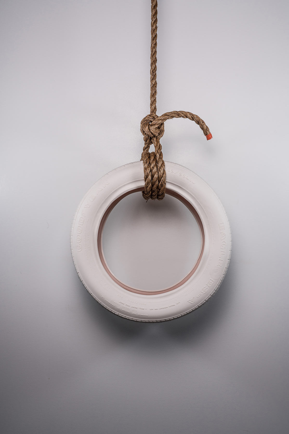 Media includes cast porcelain, glaze, rope.