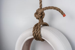 Media includes cast porcelain, glaze, rope.