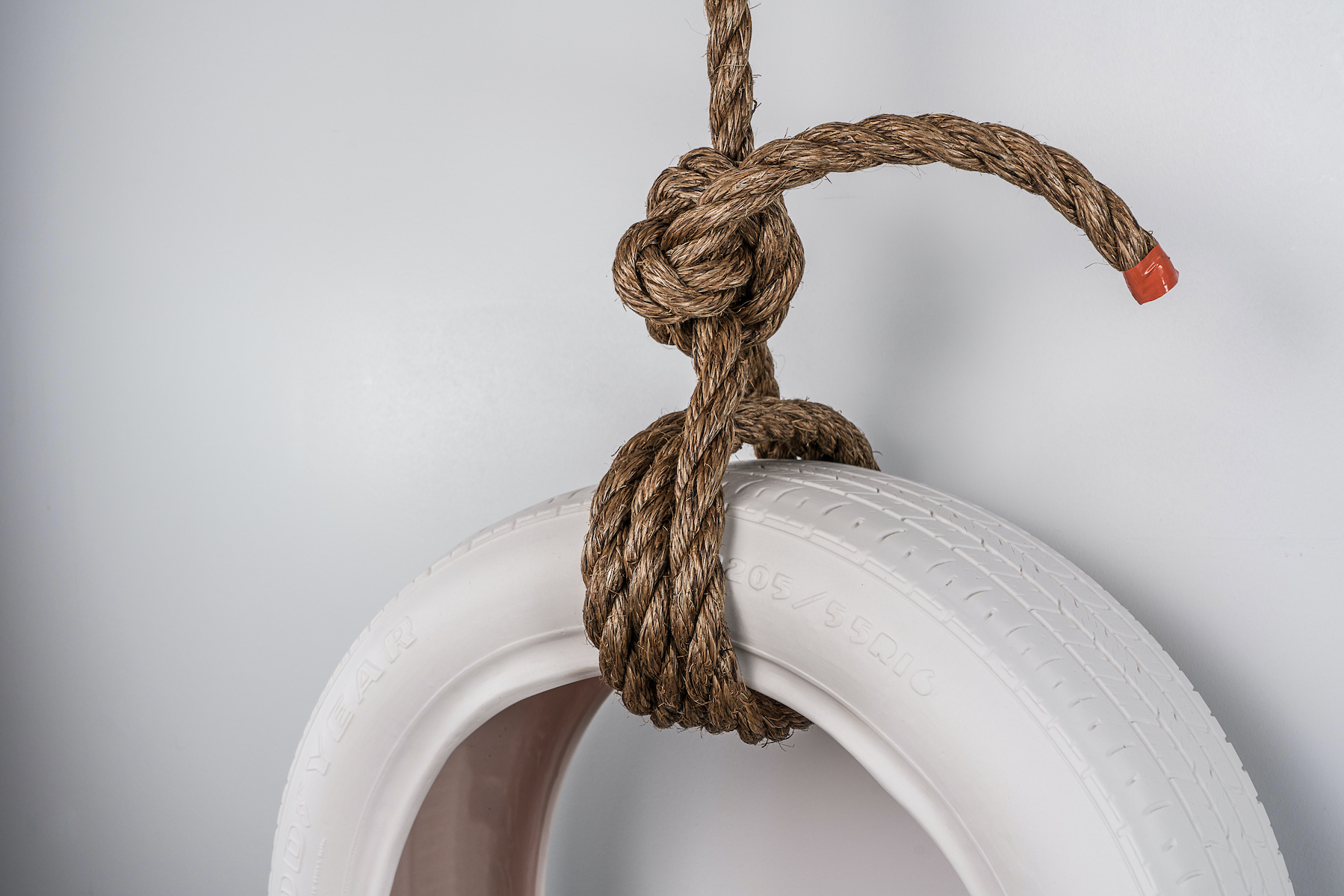 Media includes cast porcelain, glaze, rope.