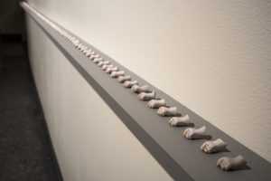 Porcelain hand found at beach. Leif Erikson Park, Duluth, MN. 2016. Subsequent objects fabricated from memory of original.