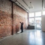 This exhibition shot includes 3 installations: 
'Kiss the Joy as it Flies': 400 geometric abstracted birds in flight across the brick wall (handbill and oxidation fired)
'The Skin We're In': 9 abstracted figurative sculptures  (thrown and crater glazed, 3ft tall each)
'A Speck of Dust' :  starry porcelain orbs installed as a 9’ buoyant shimmering circle.

Photo credit: Cathie Ferguson