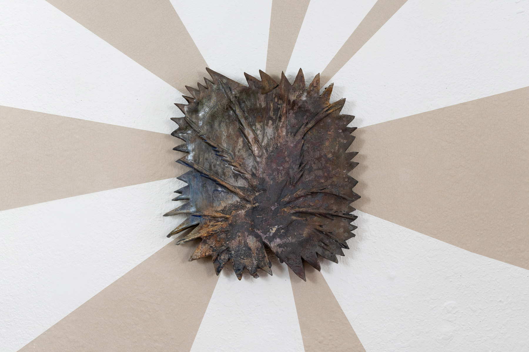 Behind these wall pieces are unfired slip, made from the same clay as the sculptures. As the exhibition went on, the slip slowly cracked. The beams symbolize the joy and hope these prairie inspired creatures giving me. The cracking brings a reality of trying to sustain this hope in an often harrowing world.