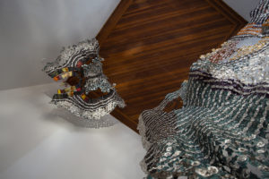 Recycled materials (plastic, aluminum coffee capsules and wine bottle seals), copper staples, copper wire
