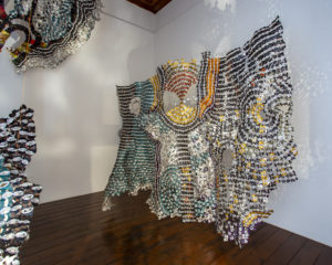 Recycled materials (plastic, aluminum coffee capsules and wine bottle seals), copper staples, copper wire