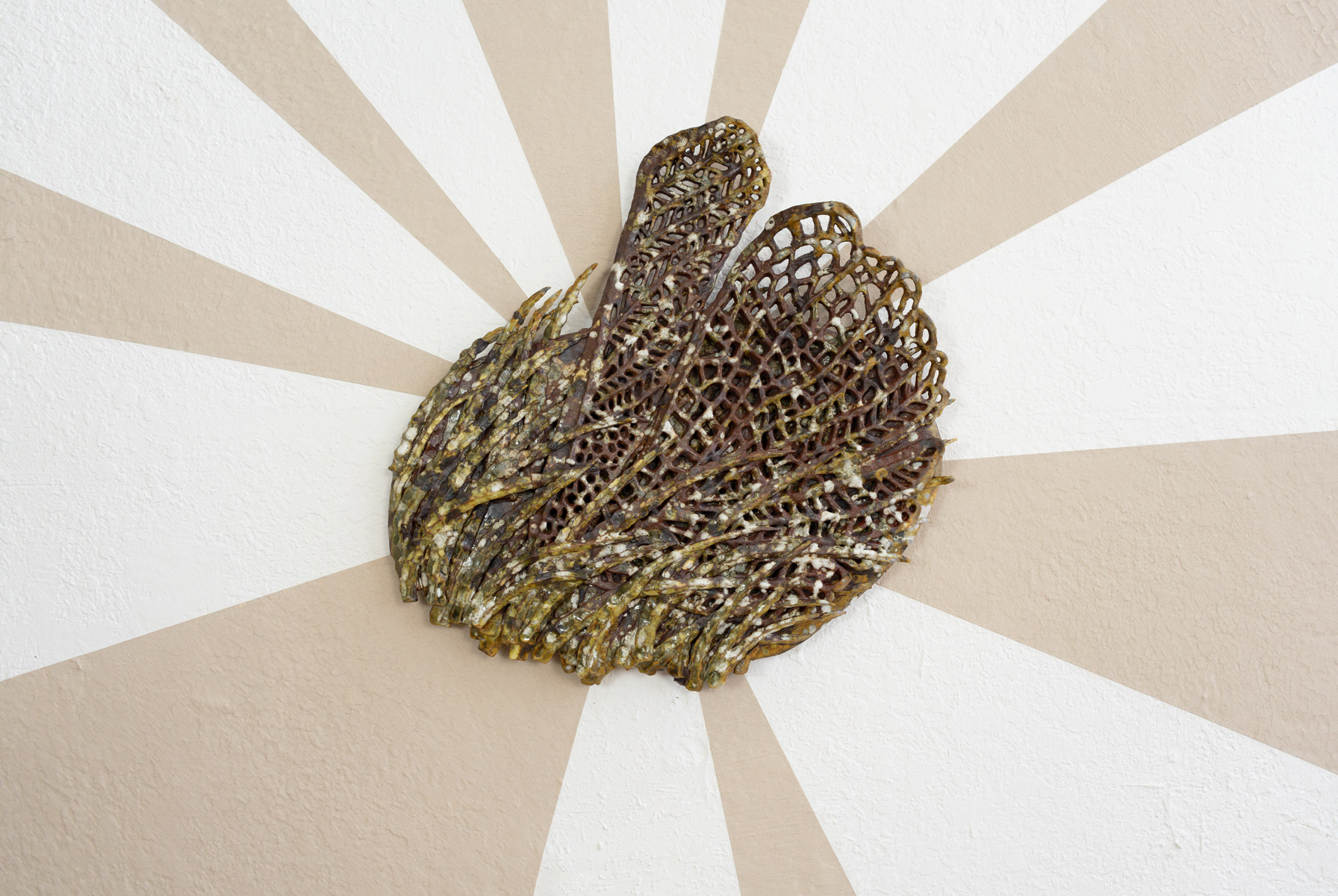 Behind these wall pieces are unfired slip, made from the same clay as the sculptures. As the exhibition went on, the slip slowly cracked. The beams symbolize the joy and hope these prairie inspired creatures giving me. The cracking brings a reality of trying to sustain this hope in an often harrowing world.