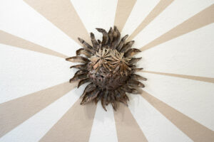 Behind these wall pieces are unfired slip, made from the same clay as the sculptures. As the exhibition went on, the slip slowly cracked. The beams symbolize the joy and hope these prairie inspired creatures giving me. The cracking brings a reality of trying to sustain this hope in an often harrowing world.