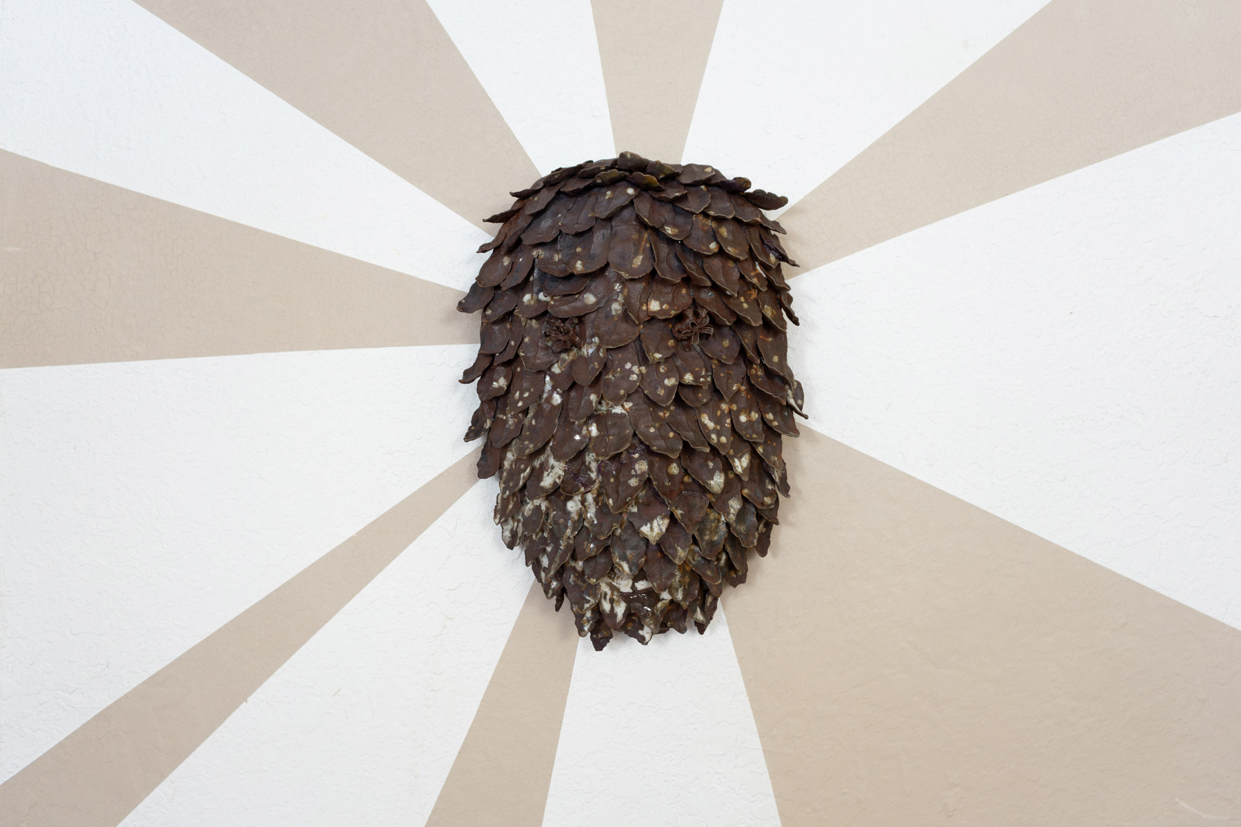 Behind these wall pieces are unfired slip, made from the same clay as the sculptures. As the exhibition went on, the slip slowly cracked. The beams symbolize the joy and hope these prairie inspired creatures giving me. The cracking brings a reality of trying to sustain this hope in an often harrowing world.