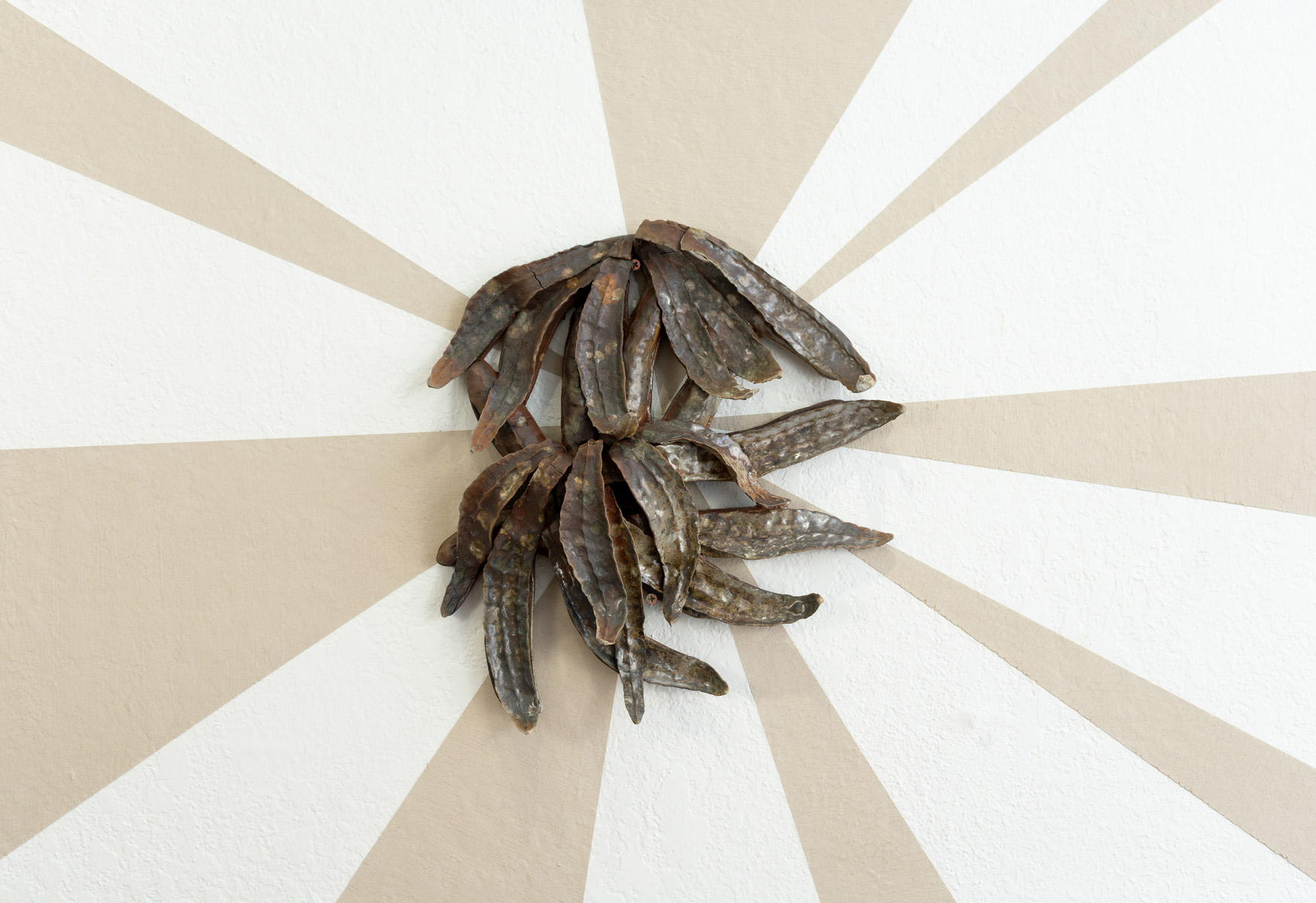 Behind these wall pieces are unfired slip, made from the same clay as the sculptures. As the exhibition went on, the slip slowly cracked. The beams symbolize the joy and hope these prairie inspired creatures giving me. The cracking brings a reality of trying to sustain this hope in an often harrowing world.