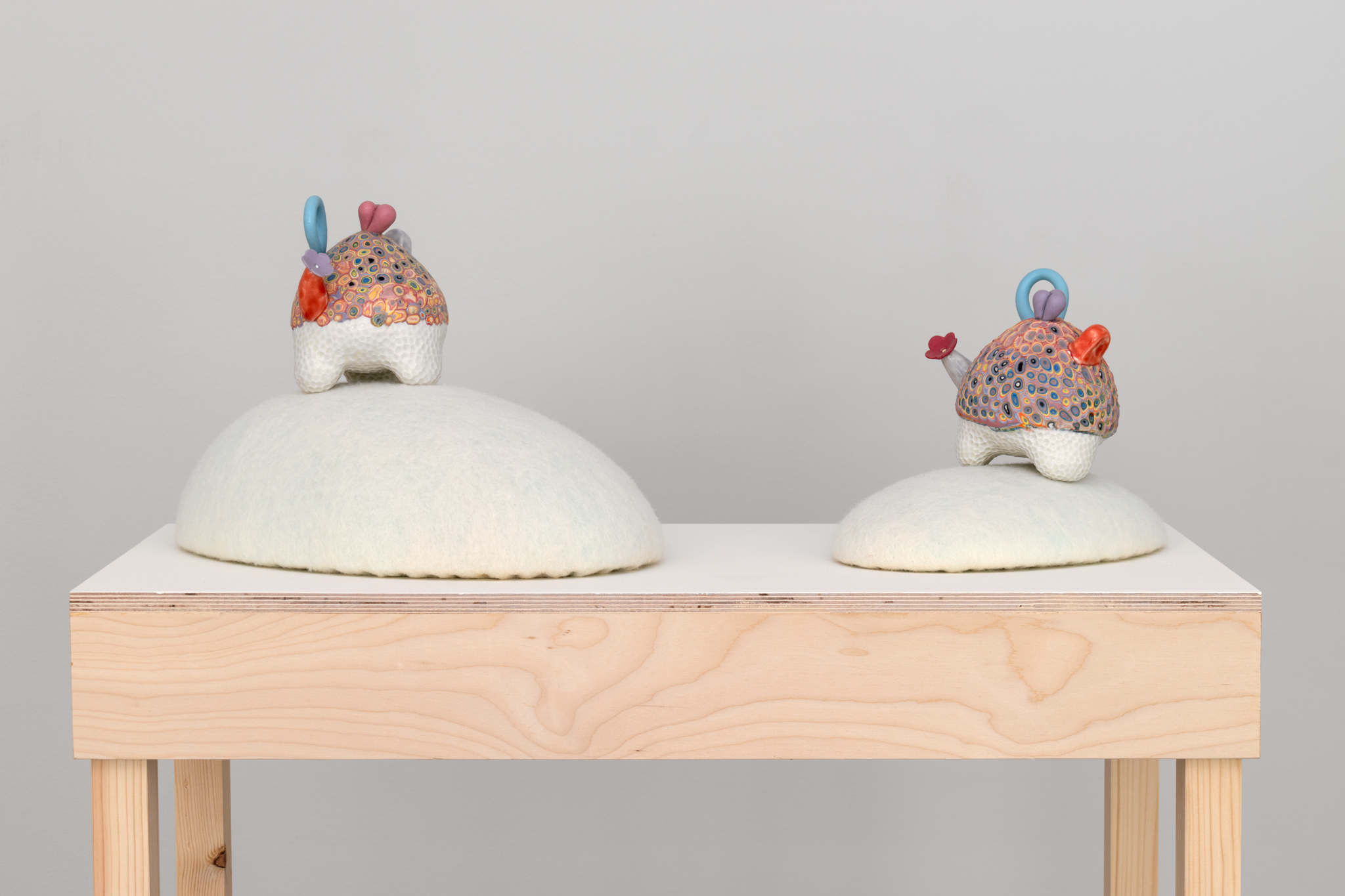 Ceramic, layered porcelain slip, colored porcelain, felted wool, foam