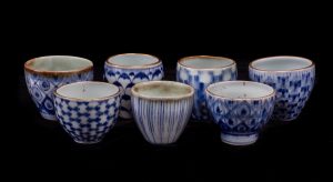 This work features celadon glaze and  Kiangxi quinhua - Jingdezhen under-glaze blue and white - and 24 k Roman gold. These pieces utilize a runny celadon glaze gas reduction fired, and re-firing at low temperature for gold and enamel applications. Gold nuggets are stoneware clay fragments with gold applications.