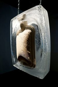 Silent Scream is a durational and immersive ceramics and video installation. The impending shatter of clay bodies frozen in ice, presents a sense of contingency and precariousness in viewers, the anticipation of fracture. As the ice melts the body of the bottle slowly reveals itself, and as if gazing into the disappearing haze of a clouded mirror you begin to see yourself: an empty vessel, headless, perhaps heedless, with gaping mouth frozen into a silent scream. Here the systemic failures, fragilities and unpredictability of living in this historical moment is felt bone-deep before the truth of it is fully, mindfully apprehended.