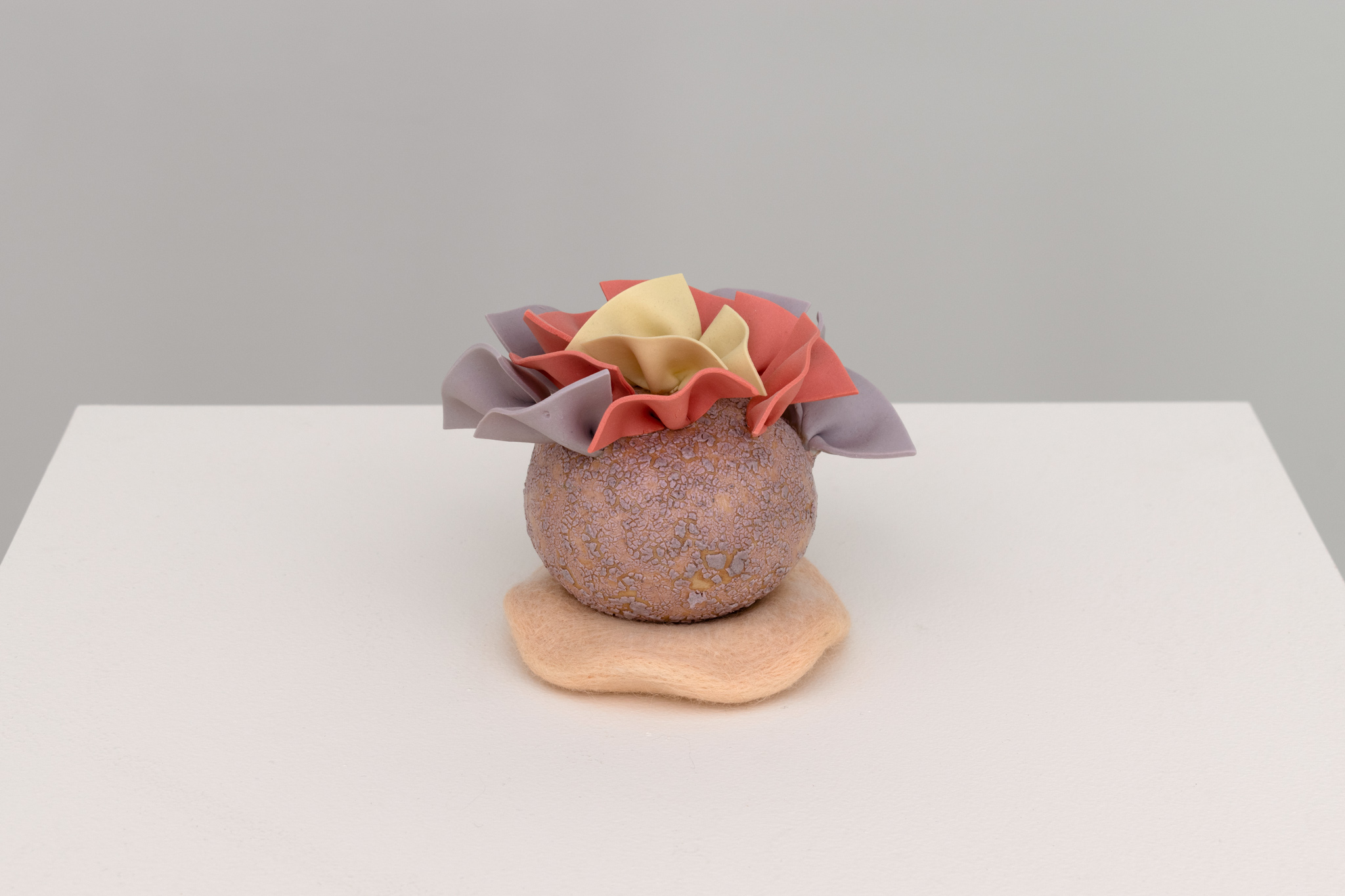Ceramic, colored porcelain, needle felted wool