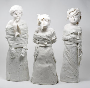 Asylums often allowed patients to keep caged canaries. What they did with them was their business. Birds were press-molded then stretched and purposely misshaped.  Straight-jackets & skirts made from slip-dipped workman blue, disposable  paper towels -  it was the man who often made the admittance call to the asylum.
