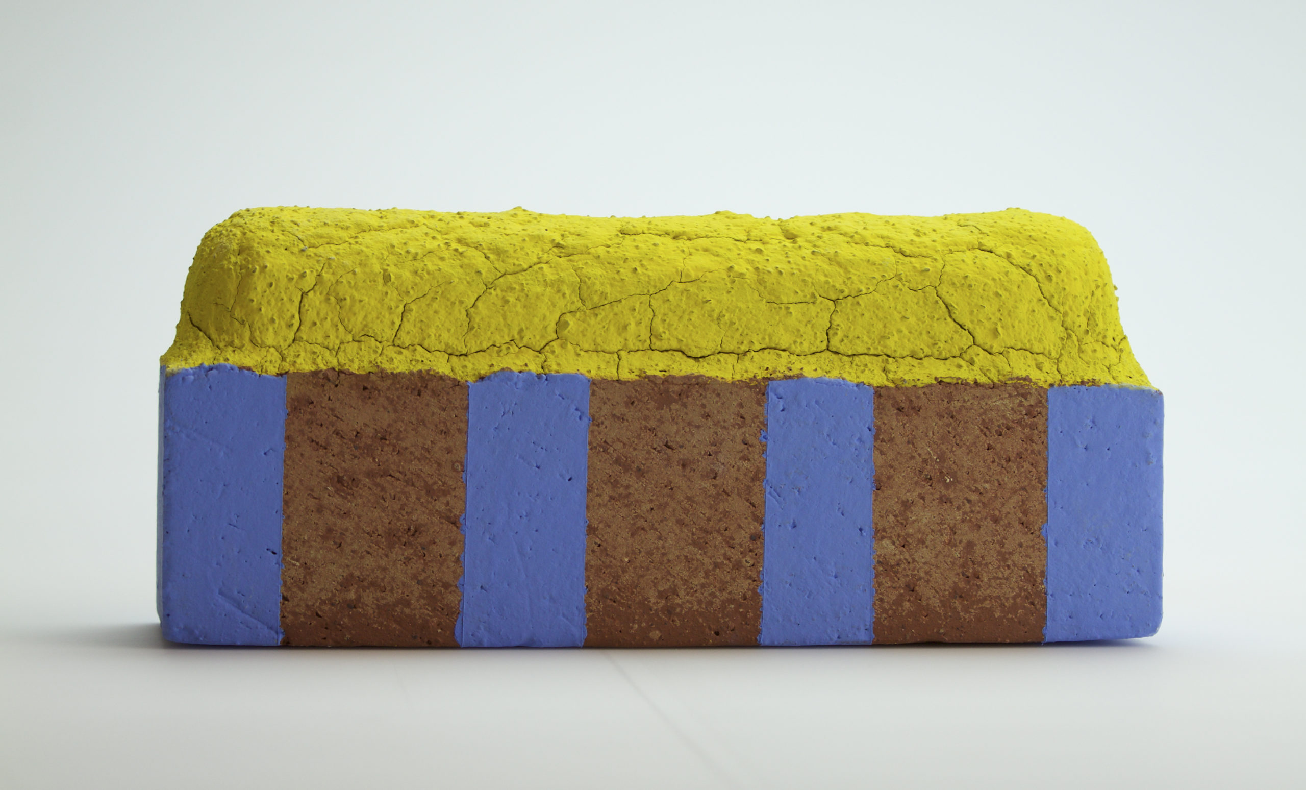 Raw brick altered, fired, underglaze