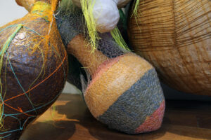 Materials: Hand built Earthenware, Porcelain, Stoneware, Woven Electrical Wire, Knit and Crocheted Fishing Line, Handmade paper pulped from Upcycled Old Clothes (Denim, Cotton, Linen) and Plants (Flax, Dahlia), Antique Hooks, Rust Dye