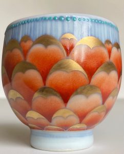 This piece features under-glaze blue and white (quinhua), Chinese over-glaze enamels and 24k Roman gold. It was gas reduction fired to cone 10 and re-fired to low temperature in 3 firings for gold and enamels.