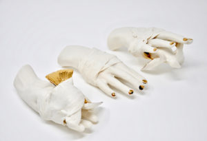 This sculpture combines use of a 4-part mold of the artist's hand with a found 3-part bird mold. The pieces are altered and combined then wrapped with slip-dipped paper towels.