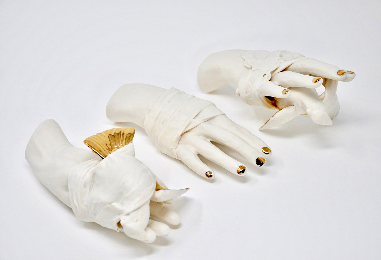 This sculpture combines use of a 4-part mold of the artist's hand with a found 3-part bird mold. The pieces are altered and combined then wrapped with slip-dipped paper towels.