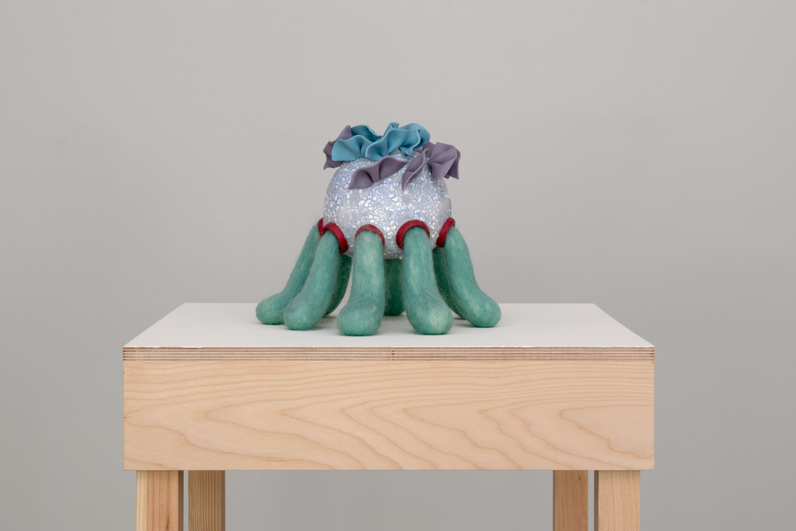 Ceramic, colored porcelain, needle felted wool