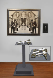 This installation includes : 5 porcelain pieces,  altered and framed archival photograph, framed screwdriver and metal pedestal. My grandmother Elsie married a drunk. These porcelain tools represent everyday household items she used to keep her husband at bay and her children safe. The photo is of her and her husband - the clear side represents her sharp vision while the blurred represents his. The small framed tool was original to Elsie.