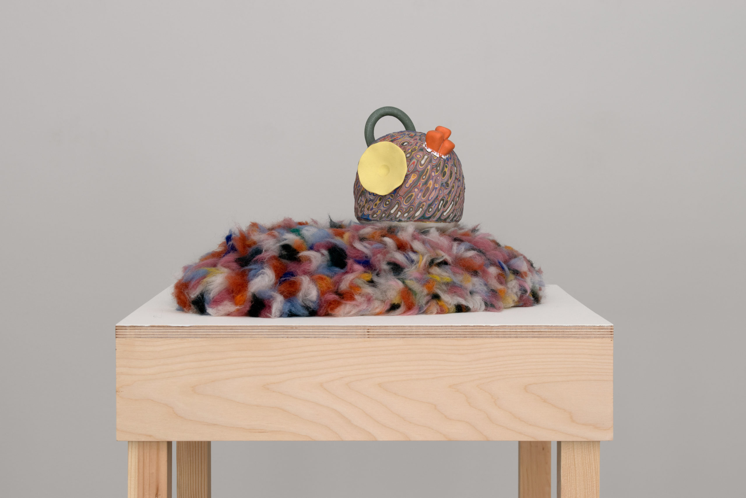 Ceramic, layered porcelain slip, colored porcelain, needle felted wool
