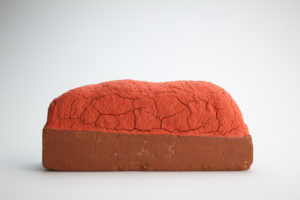 Raw brick, altered and fired, underglaze