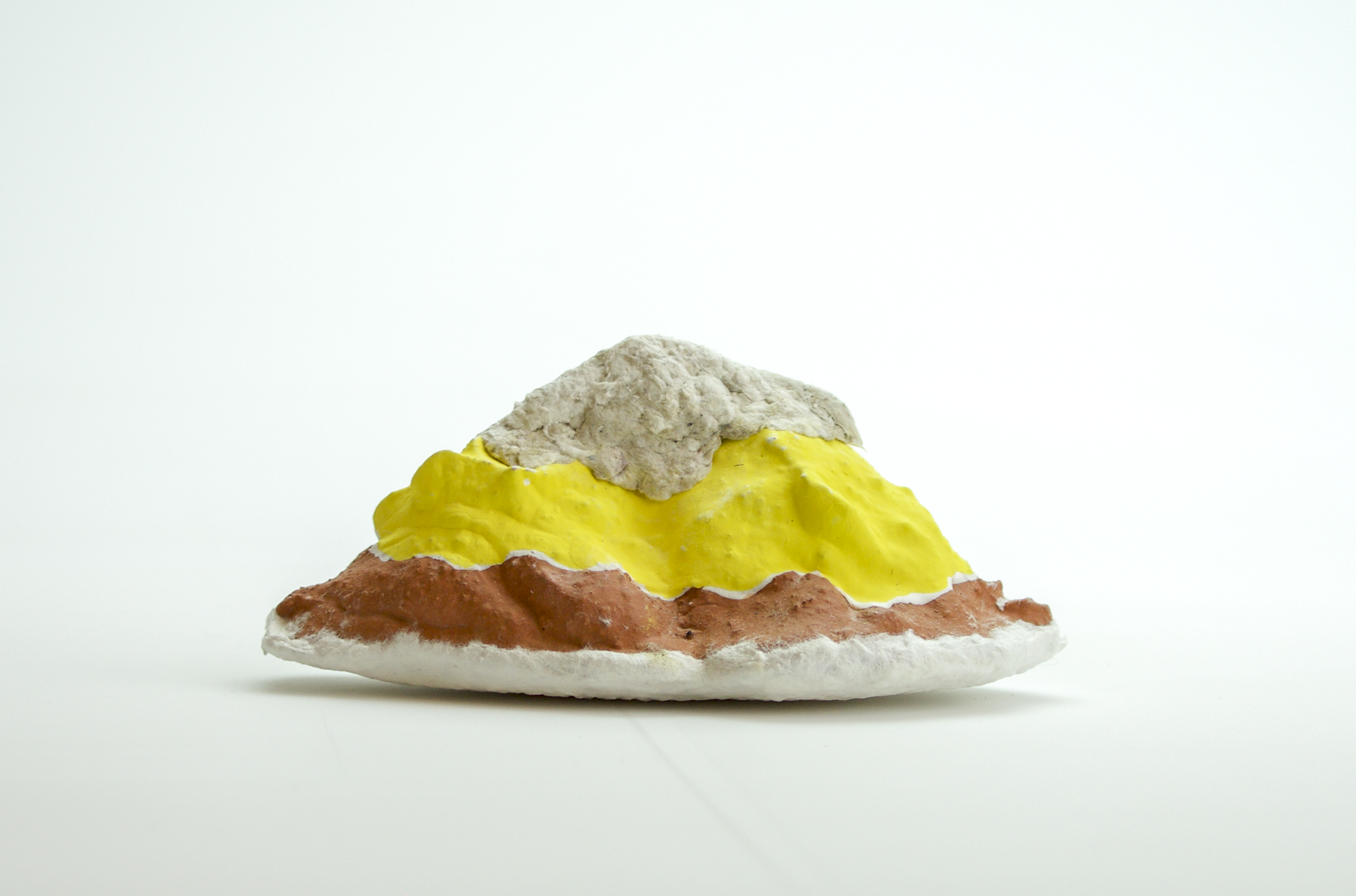 Fired and underglazed ceramic, cast paper additions