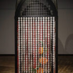 This 12-foot tall mixed-media sculpture uses 3,840 stitched together ceramic watermelons to visually express the distinct contrast between the perception of Palestinians and the reality I’ve always known as a Palestinian-American. This work addresses stereotypes, propaganda, misinformation, and censorship surrounding the image of Palestine within pop culture, while extending Palestinian traditions. Screen printed and hand painted watermelons act as a barrier, creating a protected space for a sculpture of the Beit Dajan orange blossom tatreez (embroidery) pattern.