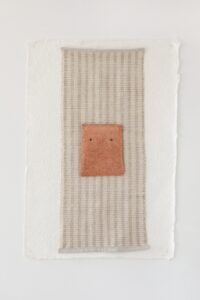 hand- - made paper
hand - - woven fiber
hand - - sculpted clay