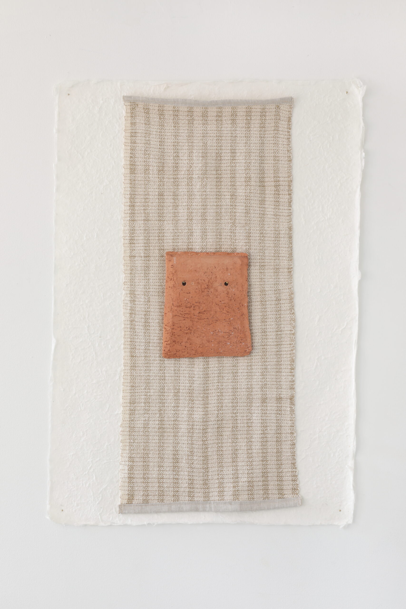 hand- - made paper
hand - - woven fiber
hand - - sculpted clay