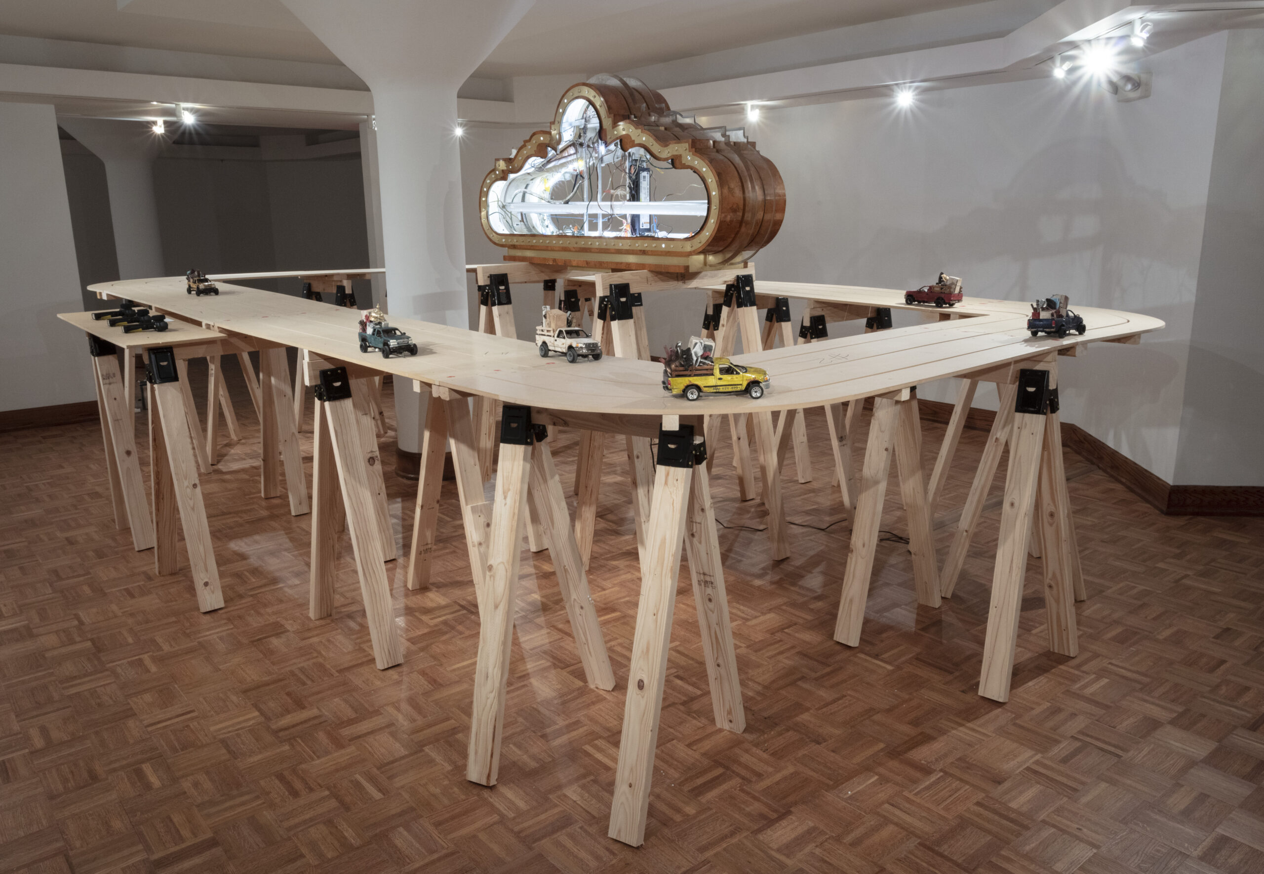 Carly Slade, Race Race ceramic sculpture art installation. Ceramic RC cars on a wooden slot car track