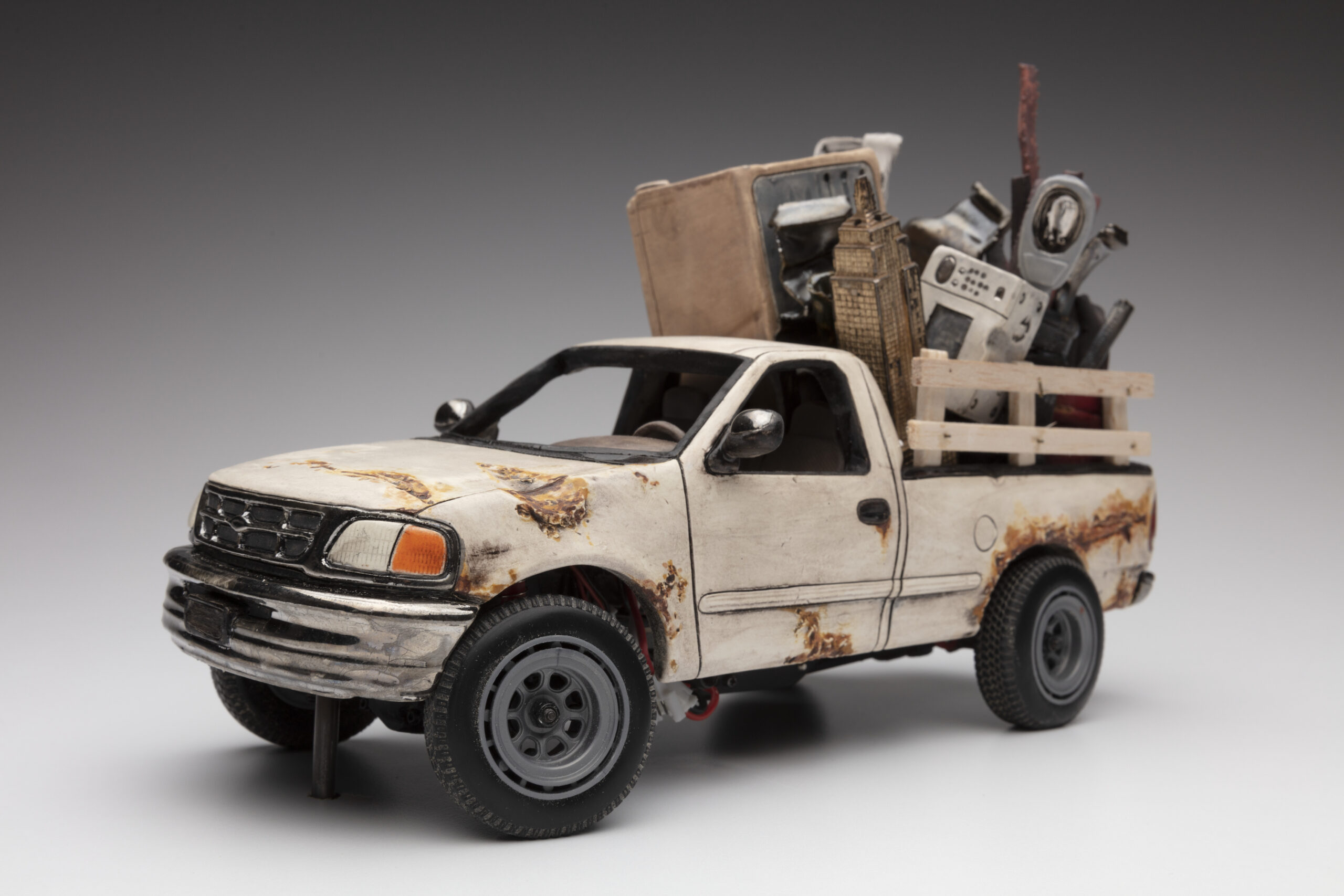 Carly Slade, Detail from Race Race ceramic sculpture art show. Ceramic RC pickup truck carrying scrap metal made from clay