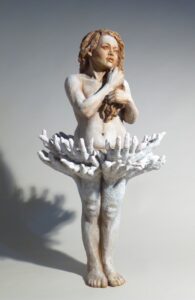 Child Support uses hand gestures as hidden energies, Child Support expresses the beauty of support found in community when raising a child. The young girl’s stance and white color represent innocence while touching her hair which metaphorically represents her power. She is a dancer and her tutu, made up of the many hands, represent community support for her passion and growth of dance.