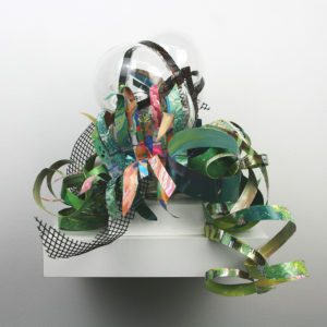 Hand blown glass with repurposed aluminum and plastic that has been hand painted.