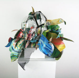 Hand blown glass with repurposed aluminum and plastic that has been hand painted.