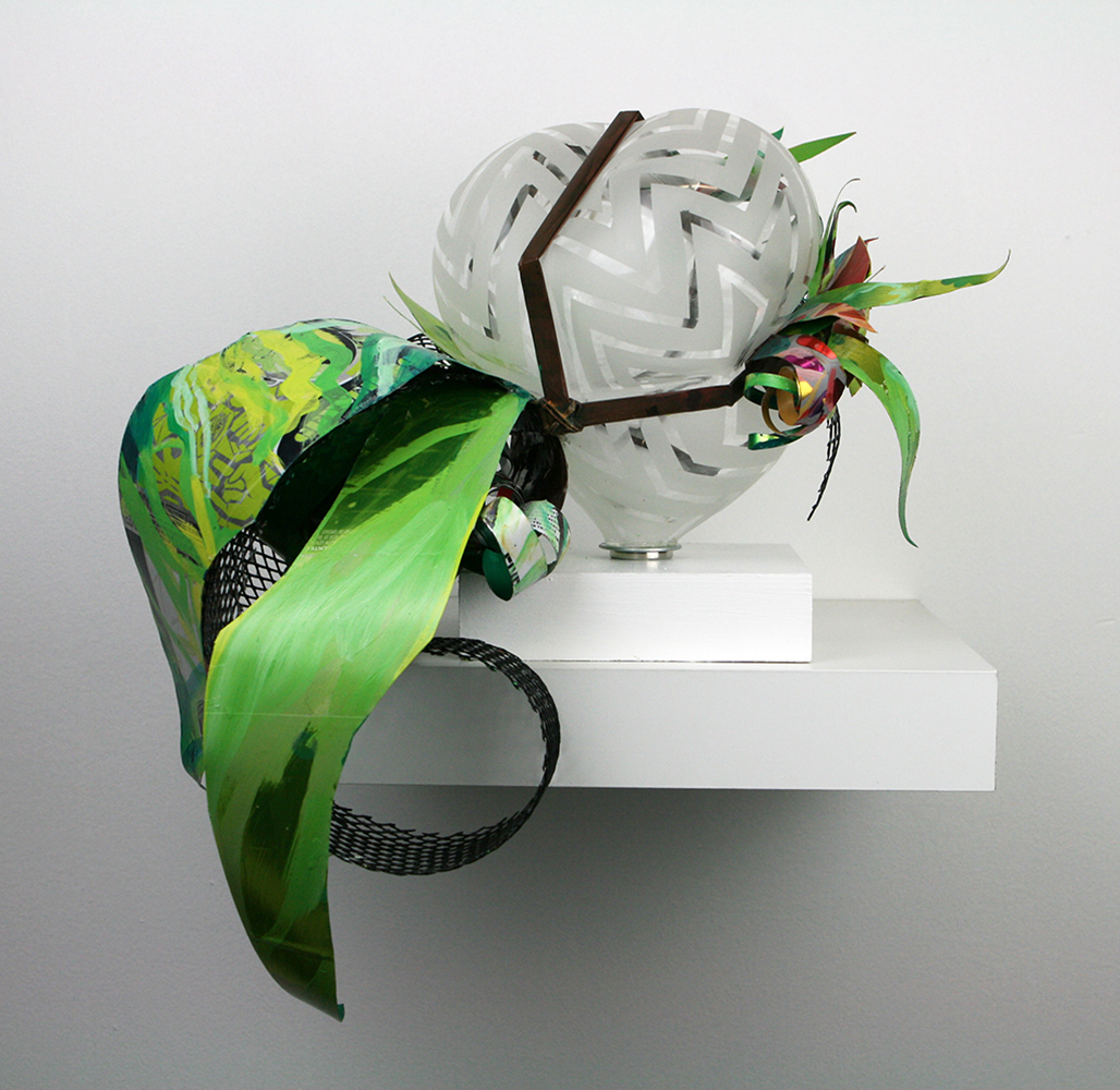 Hand blown glass that has a hand designed pattern sandblasted into the surface combined with repurposed aluminum and plastic that has been hand painted.