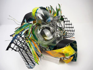 Hand blown glass with repurposed aluminum and plastic that has been hand painted.