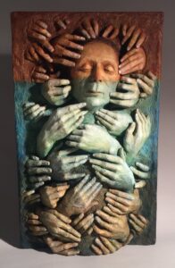 Collective Unconscious, a large scale relief,  from the series HandWork,  explores the way our point of view is influenced in the subconscious. Many hands represent the variety of ways we are moved by many others on a subconscious level. The colors range from an earthy brown for the physical and intellectual, transitioning to a watery blue as the emotional or heart level and a deeper black going into the depths of our being at the gut level. In Seven Obstacles the same care for metaphor and color will be applied.