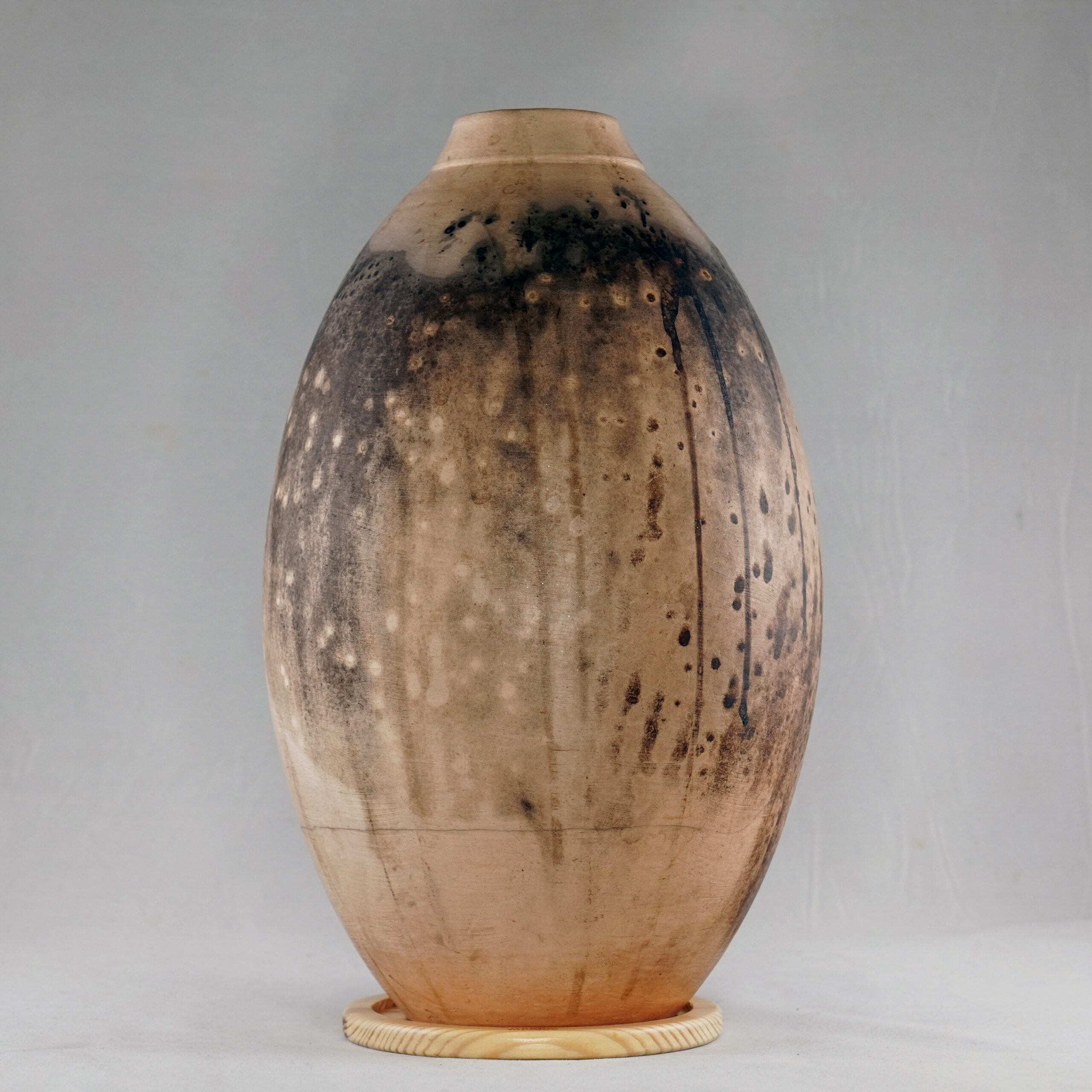 Obvara is a firing technique similar to the Raku technique, but the difference is that the vase gets dunked into a special Obvara mixture and then into water. This results in wonderful unpredictable patterns that look almost like animal prints or wood all around the vase. This technique originated from Eastern Europe and is also said to give an antique-like look to a ceramic piece.