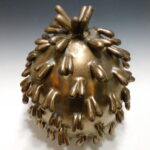 covered vessel with sculptural intent