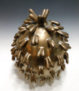 covered vessel with sculptural intent