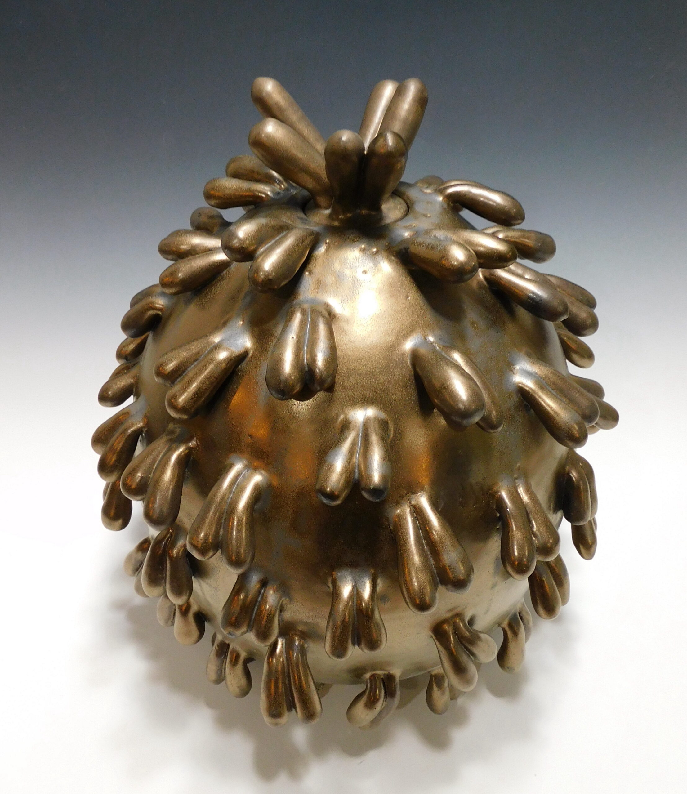 covered vessel with sculptural intent