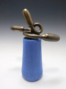 covered vessel with sculptural intent
