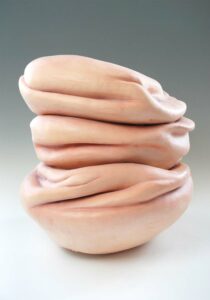 The surface of the form consists of pigmented silicone and medical sutures.