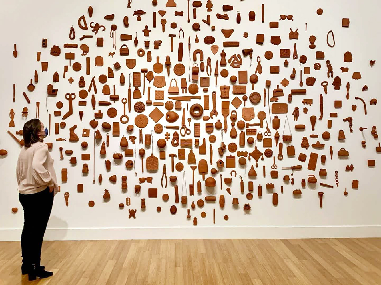 terra cotta objects on a white wall