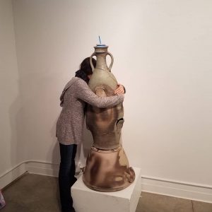 I really enjoy this photo of my friend Christina giving in to her urge to hug my piece.