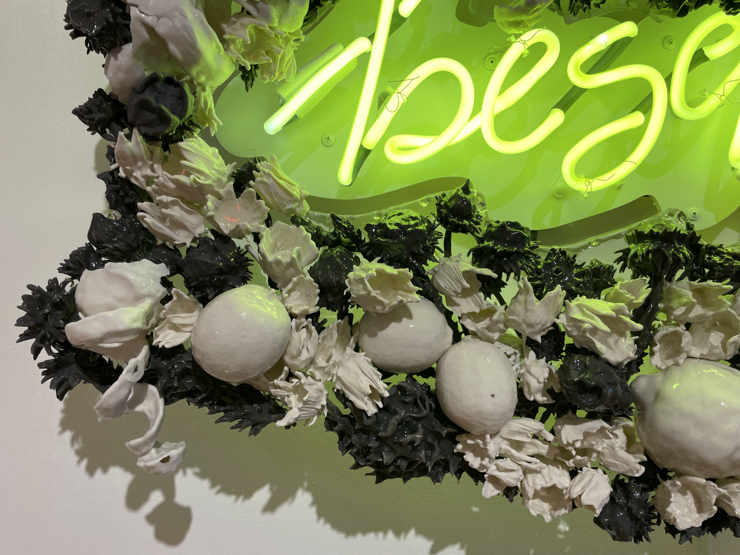 Detail showing 3D printed lemon twist, slipcast lemons, burnout arrowleaf balsamroot and thistle in black and white porcelain