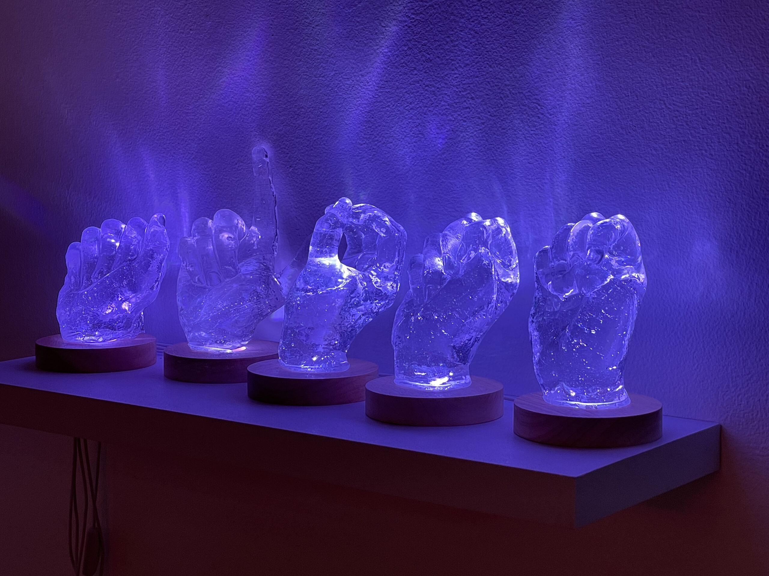 kiln-cast glass and LED lighting, ASL fingerspelling reading "alone"