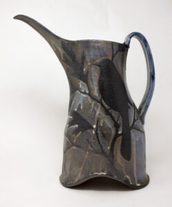 All pieces are dipped in slip, bisque fired, hand painted with wax resist designs, and dipped in a contrasting slip.